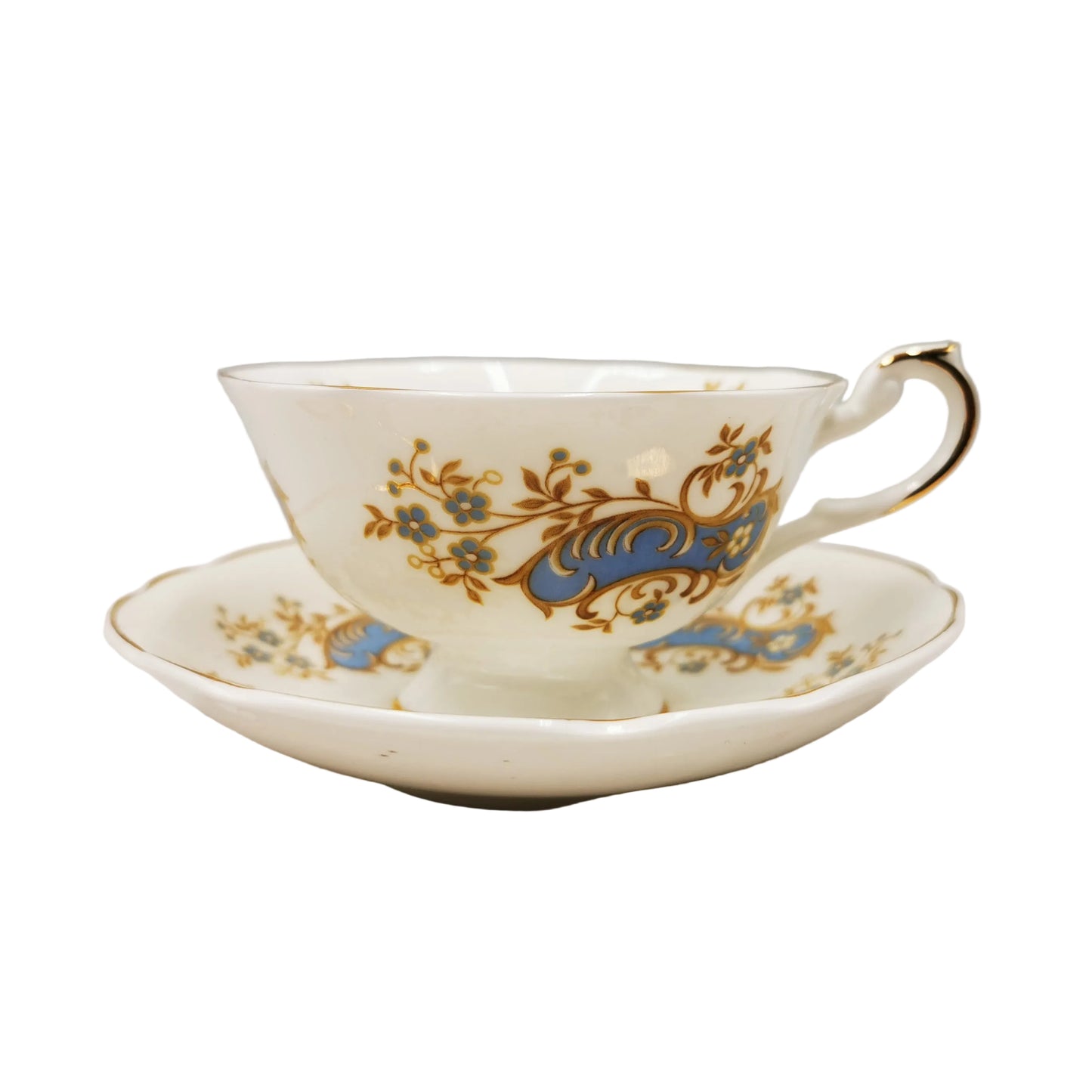 Ceramic teacup and saucer with floral patterns on a white background