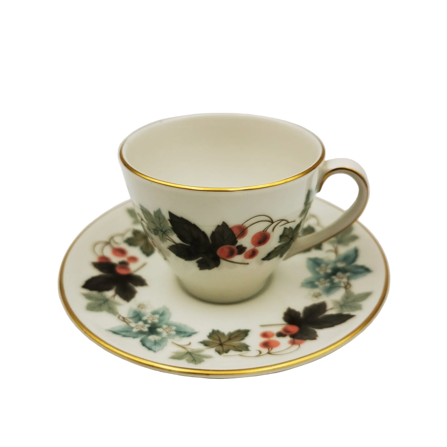 Decorative teacup and saucer with floral patterns on a white background