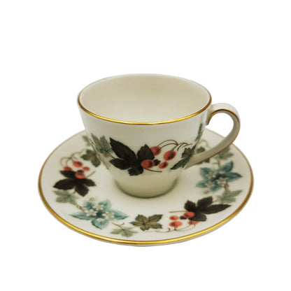 Decorative teacup and saucer with floral patterns on a white background