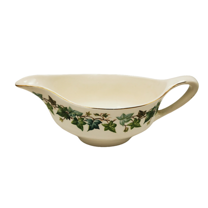 Johnson Brothers Old Chelsea Ivy Leaf Gravy Boat Cream-colored gravy boat with green leaf pattern on a white background
