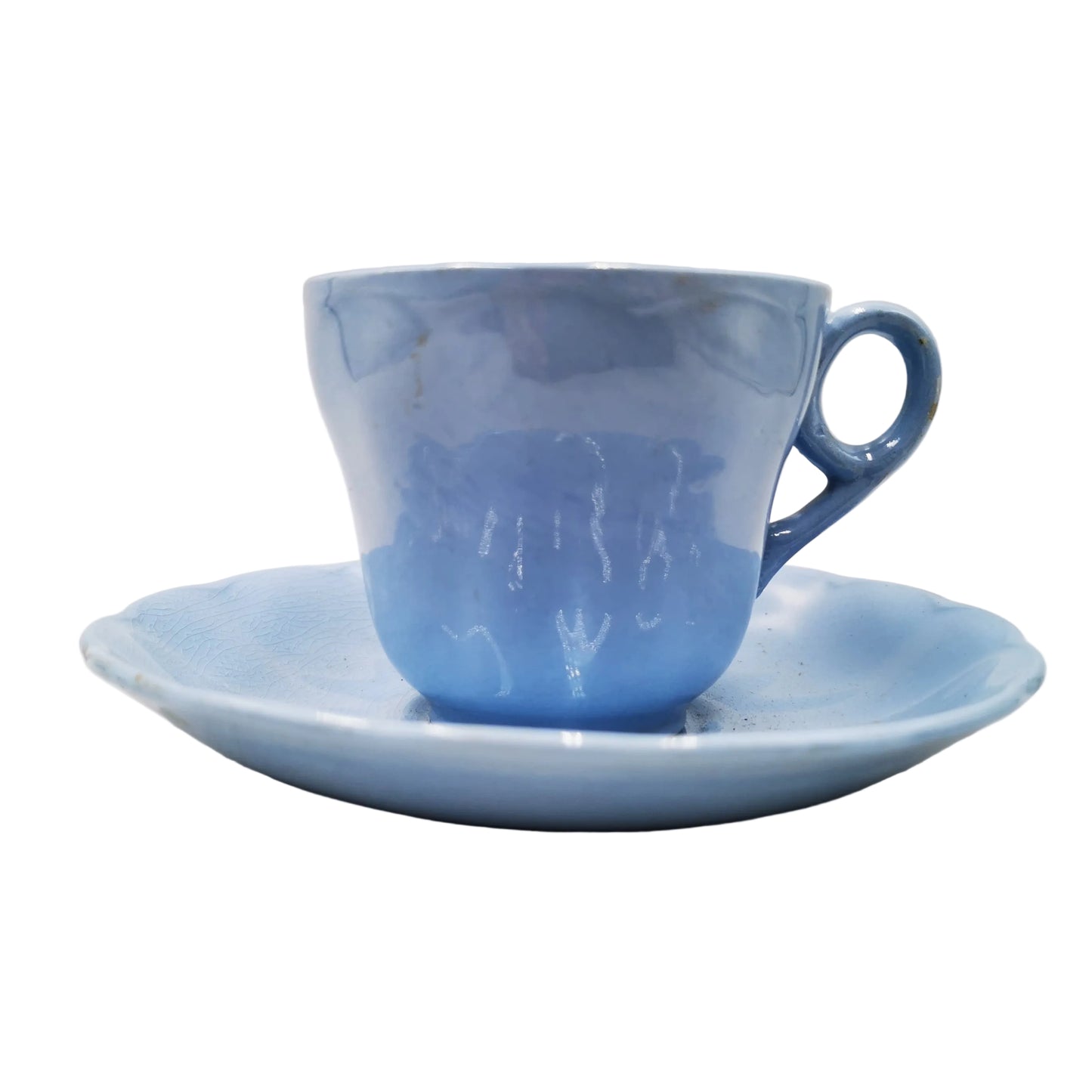A light blue ceramic teacup with a matching saucer, photographed against a neutral light gray background.