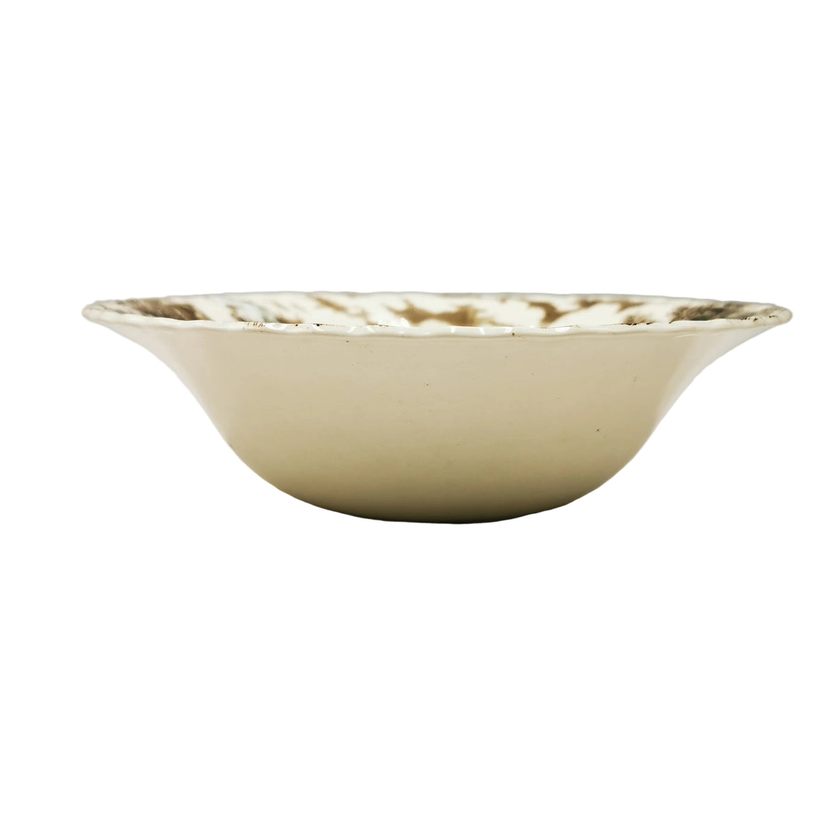 A vintage cream-colored ceramic bowl with a brown floral pattern around the rim, photographed on a neutral light gray background.