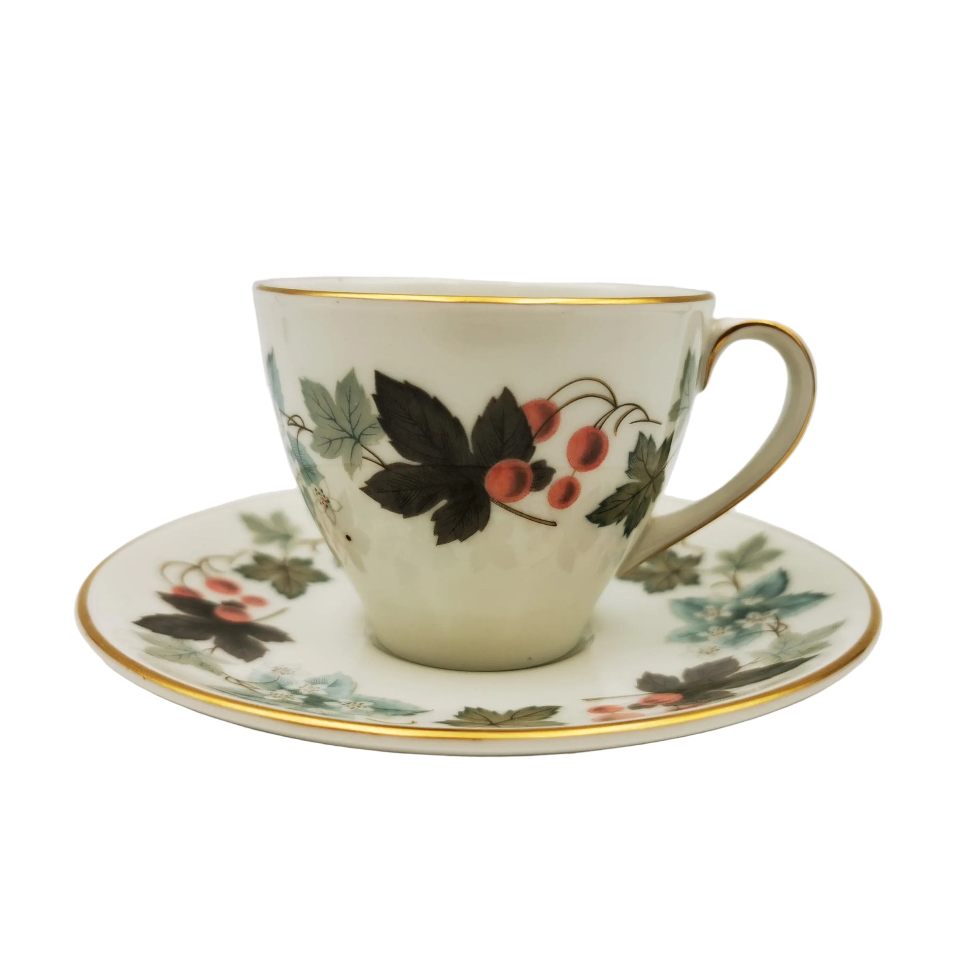 Teacup and saucer with floral design on a white background