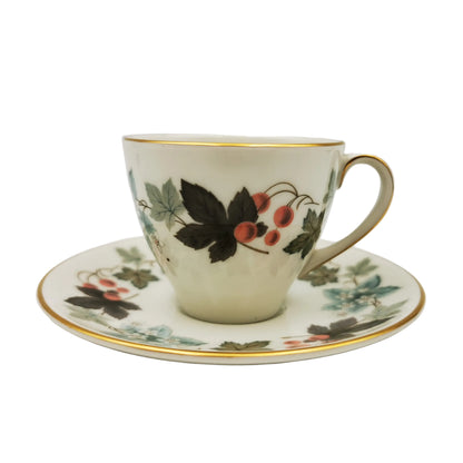 Teacup and saucer with floral design on a white background