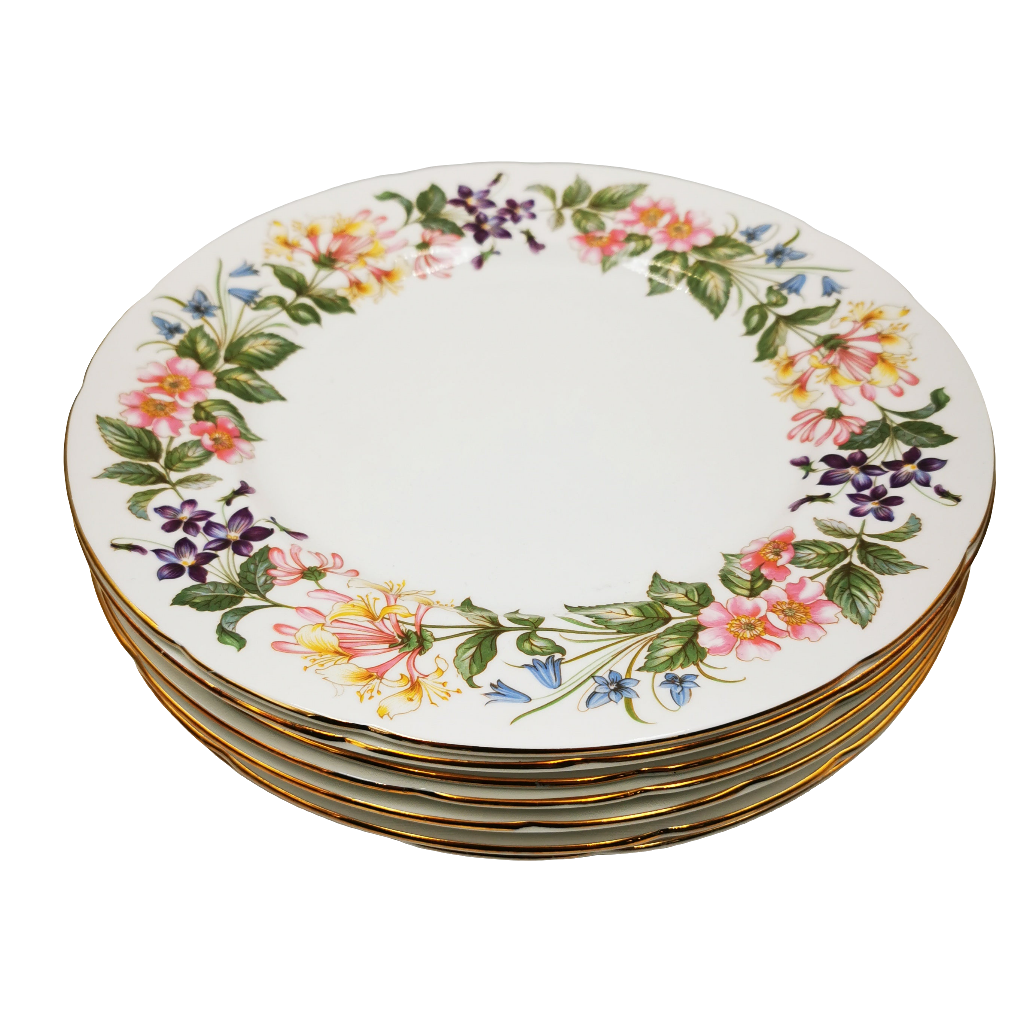 Set of ceramic plates with floral design on a white background