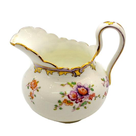 https://vintage-and-antiques.co.uk/cdn/shop/files/milk-jug-tuscan-6999-antique-china.jpg?v=1698242638&width=533