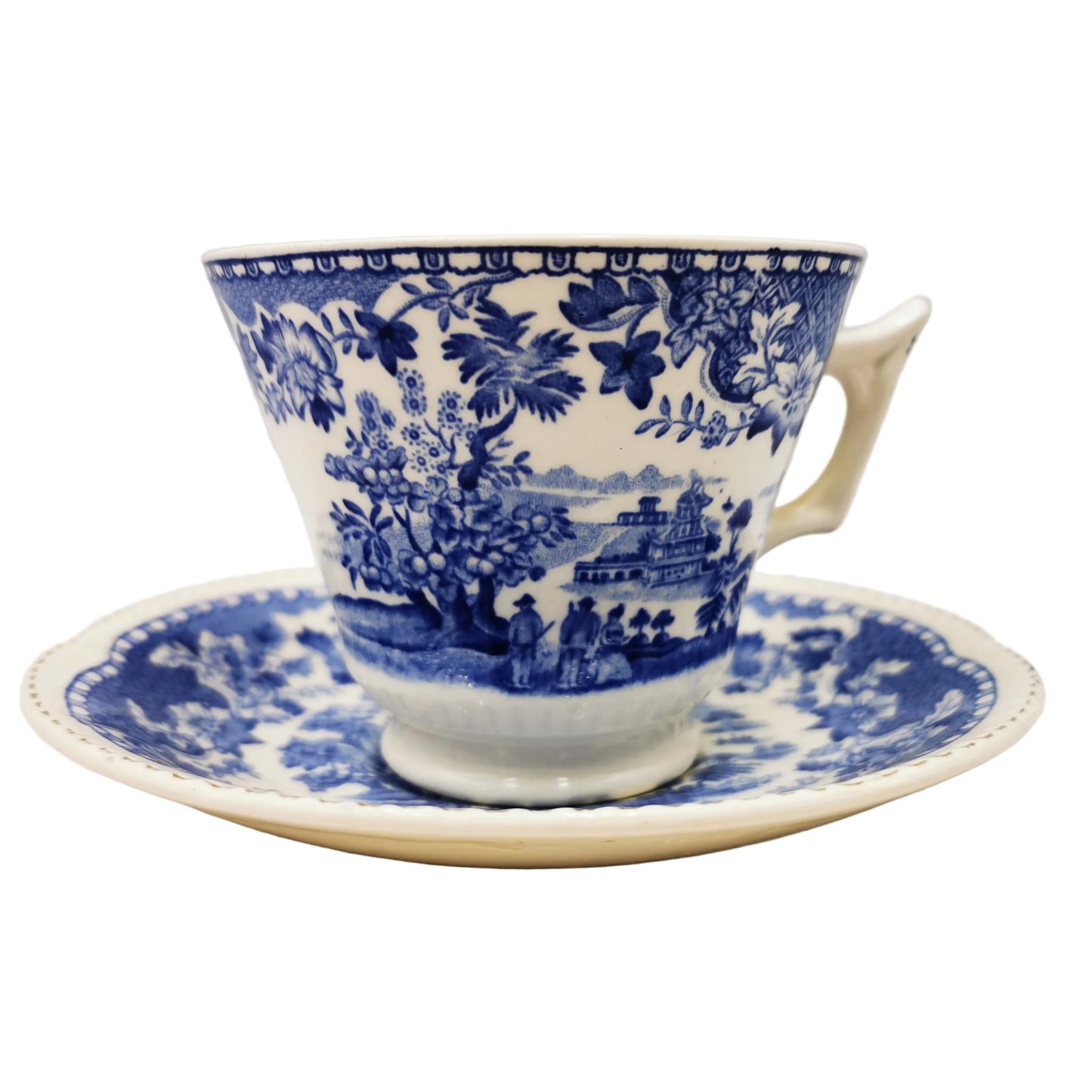 Blue and white floral teacup and saucer on a light background