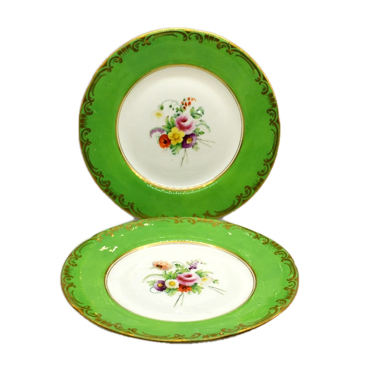 A pair of Antique Floral China Wall Plates